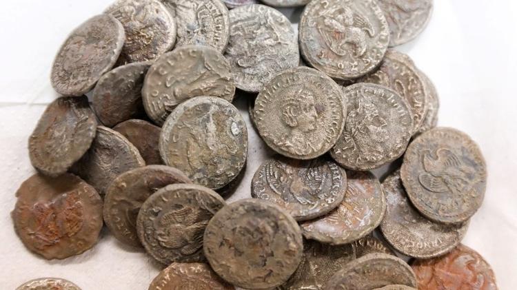 The treasure includes hundreds of Roman silver and bronze coins from the 3rd century - EPA - EPA
