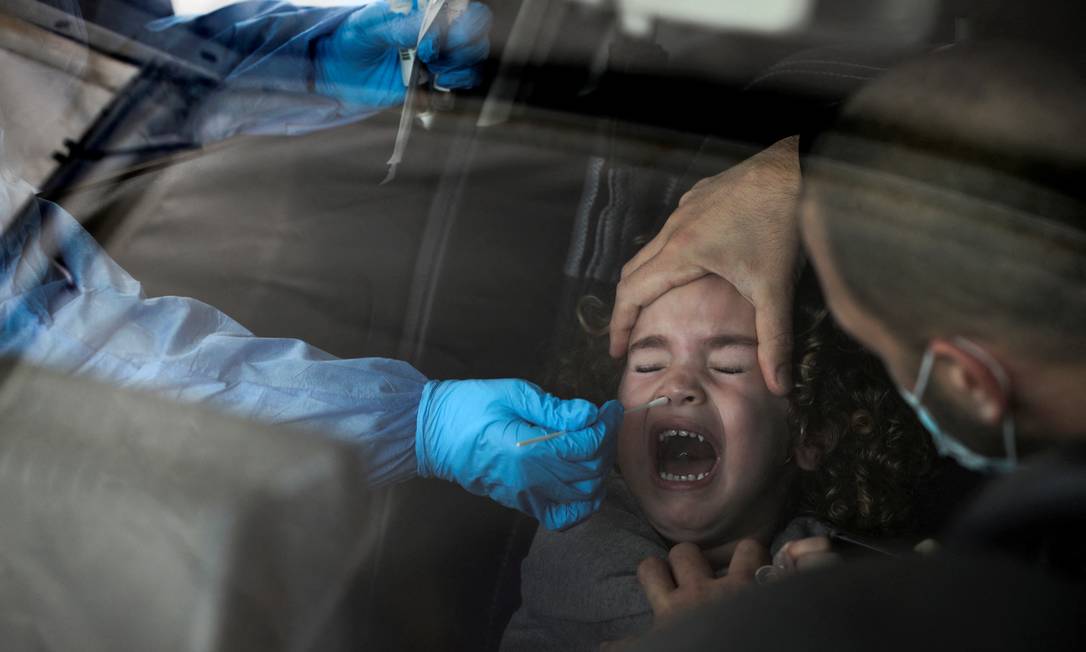 A girl being tested for Covid-19 in Jerusalem. Photo: Ammar Awad/Reuters